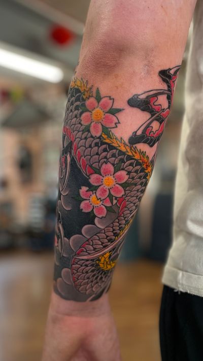 Dragon and cherry blossom wrapping forearm to be extended at a later date