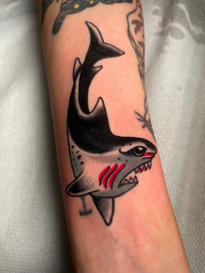 Get inked with a classic traditional style shark tattoo designed by the talented artist Angel Face.
