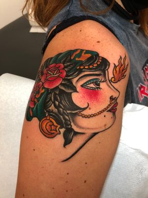 Experience the mystique of a traditional gypsy woman tattoo by the talented artist Angel Face. Embrace the beauty and magic of this timeless motif.