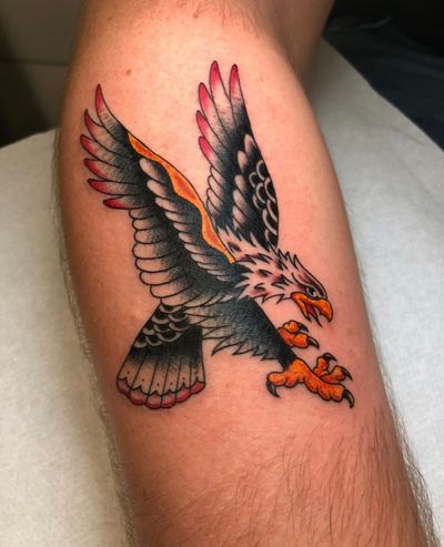 Get a classic traditional eagle tattoo by renowned artist Angel Face for a timeless and bold look. Perfect for those who love traditional tattoo styles!