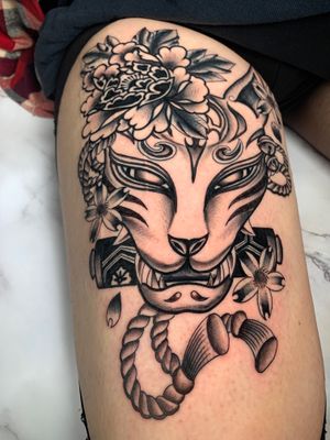 Embrace the mystique of the kitsune spirit with this stunning black and gray Japanese traditional tattoo, expertly done by Angel Face.