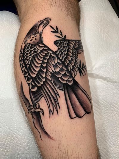 Capture the beauty and power of nature with this stunning black and gray eagle tattoo by the talented artist Angel Face.
