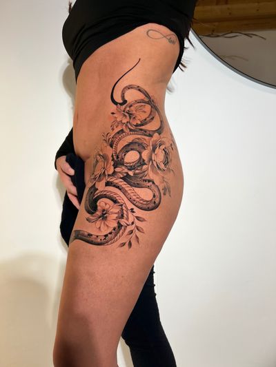 Detailed dotwork design featuring a snake and flower motif, intricately drawn by the talented artist Ion Caraman.