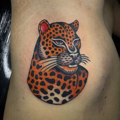 Embrace the power and grace of the wild with this stunning leopard, jaguar, and cheetah tattoo by the talented artist, Sam Young.