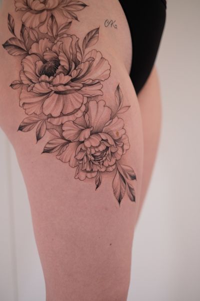 Beautiful illustrative peony tattoo done by Ion Caraman, featuring intricate floral design in fine line style.