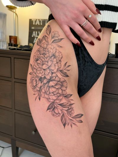 Get a stunning flower tattoo by Ion Caraman, featuring intricate fine line details and illustrative style.