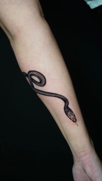 Discover the mesmerizing beauty of a black and gray illustrative snake tattoo, crafted by the talented Miss Vampira.