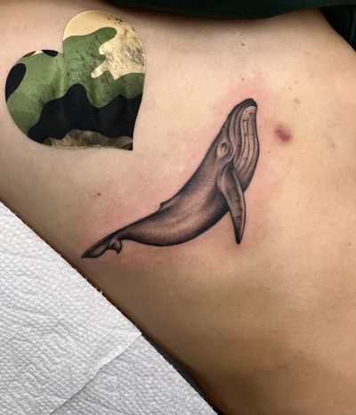 Get inked by the talented Miss Vampira with a stunning black and gray micro realism whale design. Dive into the world of intricate details and lifelike shading.