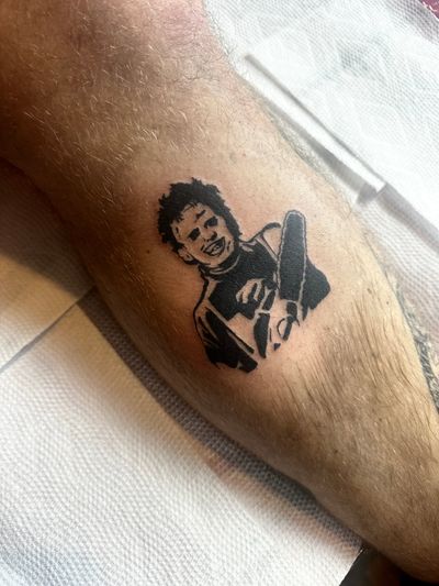 Embrace the horror with this blackwork tattoo of Leatherface from Texas Chainsaw Massacre by Miss Vampira. A chilling masterpiece.