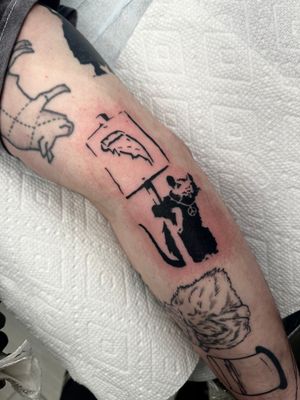 Unique blackwork tattoo featuring a pizza, rat, and mouse in illustrative style by tattoo artist Miss Vampira.