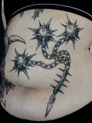 Unique dotwork style by Kat Jennings, featuring a flail and morning star motif. Stand out with this illustrative design.