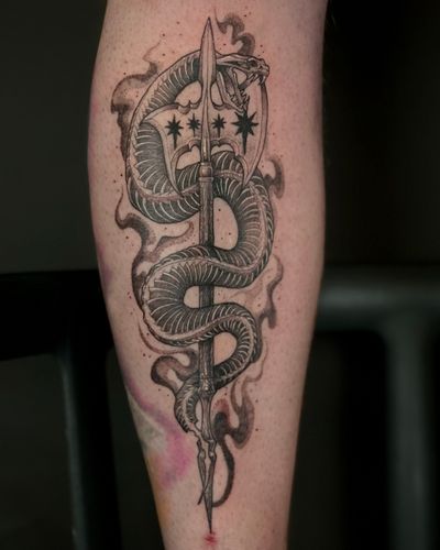 Unique dotwork tattoo featuring a snake wrapped around a spear, expertly done by Kat Jennings.