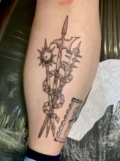 Unique dotwork design featuring axe, mace, flail, and halberd motifs, expertly inked by Kat Jennings.