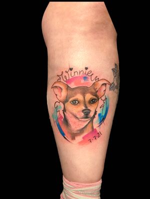 A beautiful fine line and illustrative watercolor tattoo of a beloved pet, expertly crafted by the talented artist Eve Inksane.
