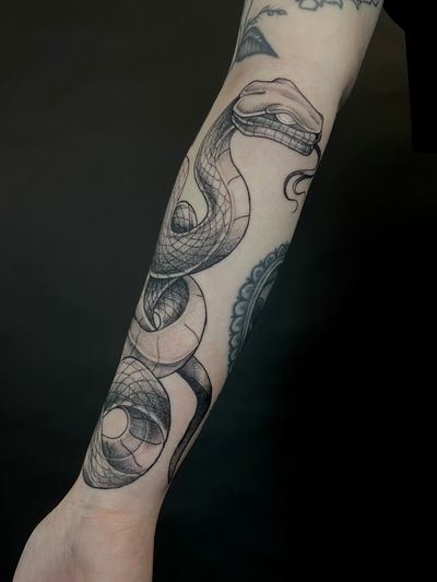 Get a unique dotwork illustrative snake tattoo by the talented artist Kat Jennings. Bold and intricately designed, this tattoo is sure to stand out.