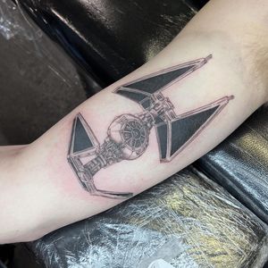 Capture the essence of the dark side with this tattoo featuring Tie Fighters, Tie Interceptors, and Darth Vader in a unique illustrative style by artist Hannah Senoj.