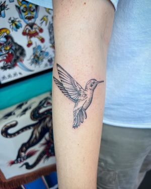 Get mesmerized by the intricate details of a hummingbird tattoo by the talented artist Hannah Senoj. Timeless elegance on your skin!