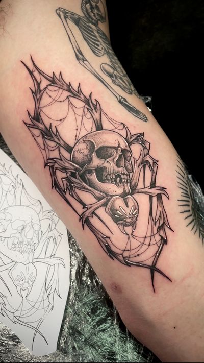 Get a stunning dotwork spider and skull tattoo done by the talented artist, Kat Jennings. A unique and intricate design perfect for those who love dark and detailed tattoos.