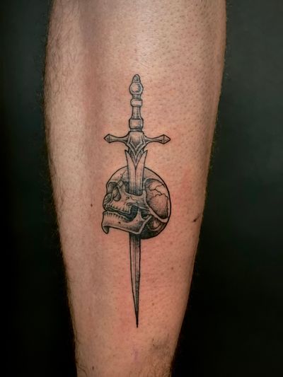 Get a unique and intricate dotwork tattoo featuring a skull and sword, expertly done by tattoo artist Kat Jennings.