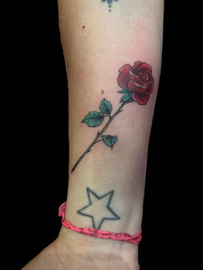 Get a vibrant and beautiful illustrative rose tattoo done by the talented artist Eve inksane.