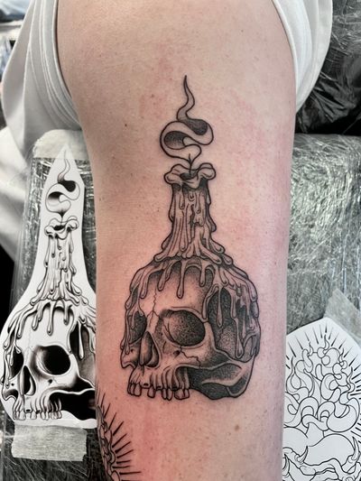 Unique dotwork tattoo featuring a skull and candle design, created by the talented artist Kat Jennings.