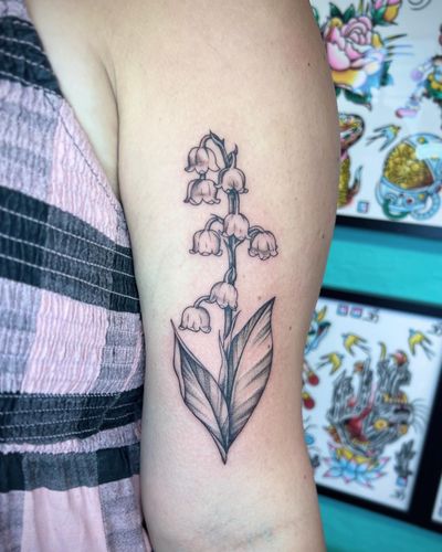 Get a beautifully detailed floral tattoo of a bell flower by the talented artist Hannah Senoj.