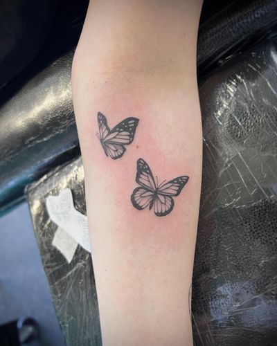 Elegantly crafted by Hannah Senoj, this stunning butterfly tattoo will make a statement with its intricate illustrative style.