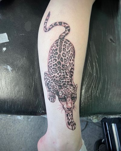 Capture the beauty and power of these majestic big cats with a stunning realism and illustrative tattoo by Hannah Senoj.