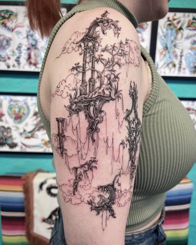 Experience a dreamlike world with floating islands, intricate filigree, and mystical clouds in this illustrative tattoo design by the talented artist, Hannah Senoj.