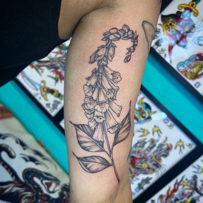 Adorn your skin with a beautiful floral bell flower tattoo designed by the talented artist Hannah Senoj. Embrace the beauty of nature and intricate details in this illustrative masterpiece.