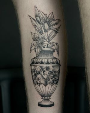 Intricately detailed dotwork tattoo by Kat Jennings featuring a beautiful orchid in a vase intertwined with a skull motif.