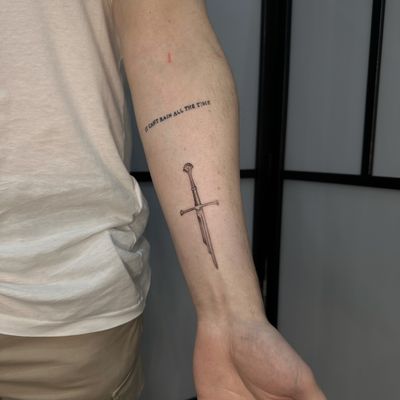 Show your love for Lord of the Rings with this stunning black and gray illustrative tattoo of the legendary Narsil sword. Perfect for fantasy fans!