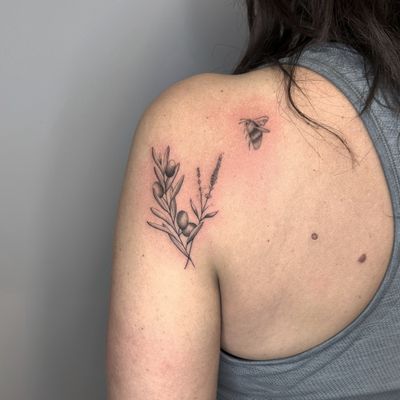 Unique dotwork and fine line design by Tas Kal featuring a bee, flower, and olive branch motif.