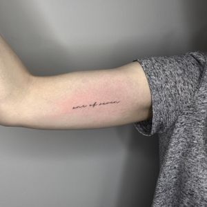 Fine line tattoo with delicate small lettering by Tas Kal, perfect for a subtle and meaningful design.