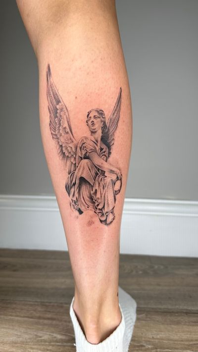 Elegant black & gray dotwork tattoo of an angelic statue, beautifully crafted by Tas Kal. A heavenly addition to your ink collection.