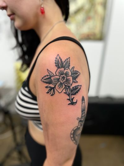 Get a timeless piece of art with this traditional rose tattoo by the talented artist River Tatts. Show off your love for flowers with this intricate design.