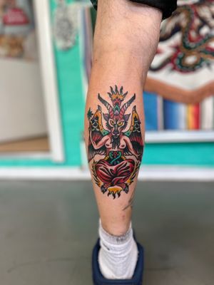 Get inked by the talented River Tatts with this striking traditional demon Baphomet design. Embrace the dark side with this bold and intricate piece.