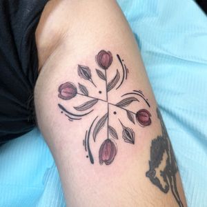 Beautiful and delicate tulip design in fine line style by the talented artist Kiky Flore.