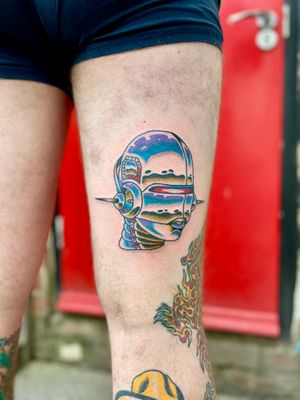 Discover a futuristic blend of man and machine with this illustrative cyborg tattoo by the talented artist River Tatts.