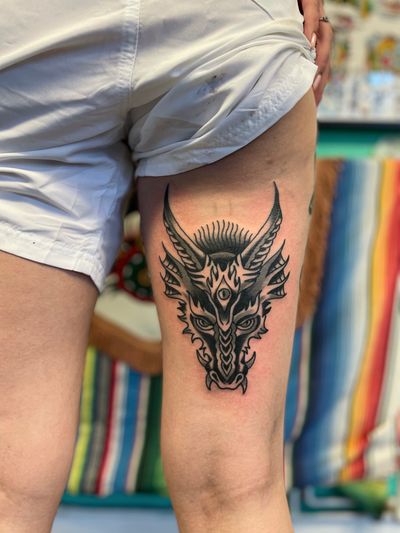 Experience the power and mystique of a traditional dragon tattoo by River Tatts. Let this captivating design symbolize strength and protection on your skin.