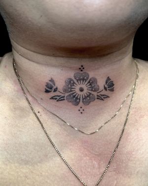 Unique dotwork hand-poke design featuring a Tudor rose flower by Indigo Forever Tattoos. Achieve a delicate and intricate look with this stunning tattoo.