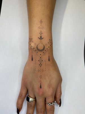 Experience the unique artistry of Indigo Forever Tattoos with this detailed hand-poked dotwork design. Intricate and mesmerizing.