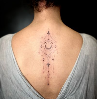 Elegant ornamental moon design by Indigo Forever Tattoos, created using hand-poke technique and intricate dotwork details.