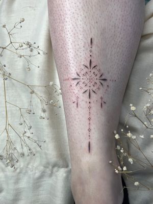 Experience the delicate beauty of Abbie Lou's dainty dotwork design, perfect for lovers of ornamental tattoos.