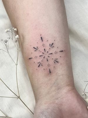 Experience the delicate beauty of dainty dotwork design by the talented artist Abbie Lou. This ornamental tattoo is a true work of art.