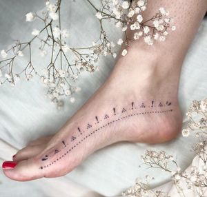 Explore the delicate beauty of dainty dotwork in this mesmerizing ornamental tattoo created by the talented artist Abbie Lou.