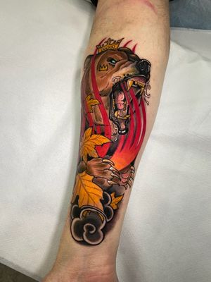 Get a bold and vibrant neo-traditional bear tattoo by the talented artist Jethro Wood. Embrace the strength and resilience of the bear with this stunning design.