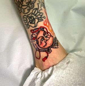 Get a whimsical twist on traditional Japanese folklore with this unique hyottoko tattoo by renowned artist Jethro Wood.