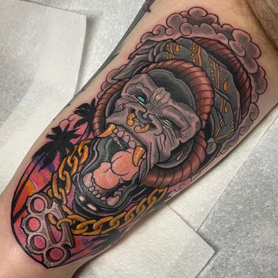 Check out this striking neo-traditional gorilla tattoo by Jethro Wood. Bold lines and vibrant colors bring this majestic creature to life!