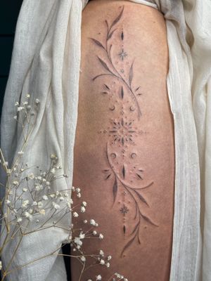 Adorn your skin with Abbie Lou's signature dotwork and hand-poke technique in this stunning ornamental design.